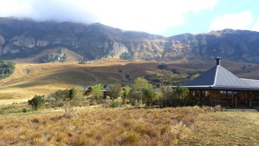 The log cabins at Drak Mountain lodge are a happy sight after a full day in the saddle